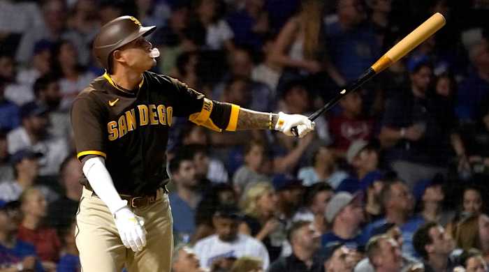 San Diego Padres’ Manny Machado blows a bubble as he watches his two-run home run off Chicago Cubs relief pitcher Rowan Wick during the fifth inning of a baseball game Wednesday, June 15, 2022, in Chicago.